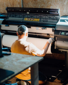 Loading wide format printer with paper