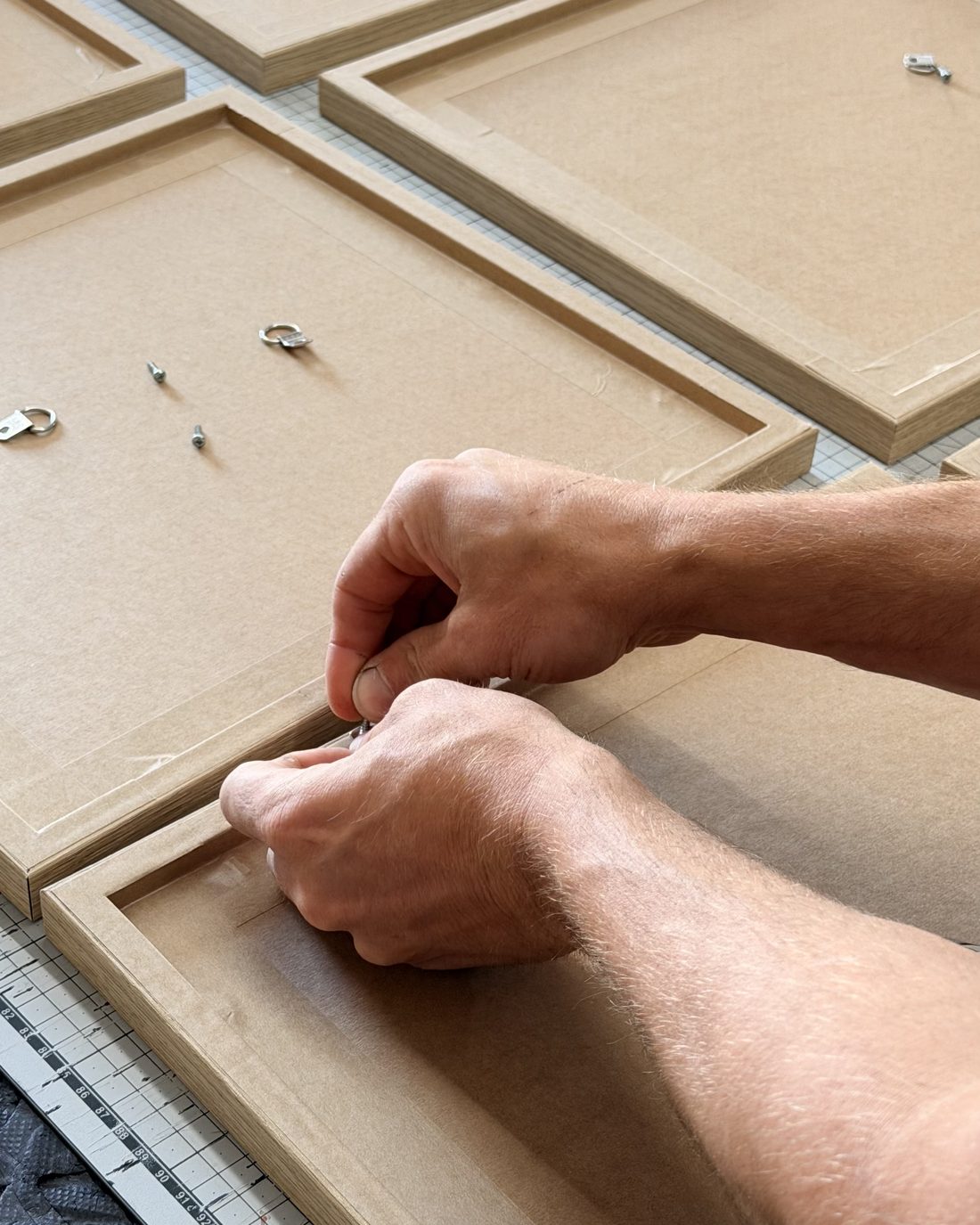 Frame backs being sealed and finished by hand in the workshop